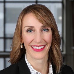 Brigid Zeller Headshot in blazer and white shirt