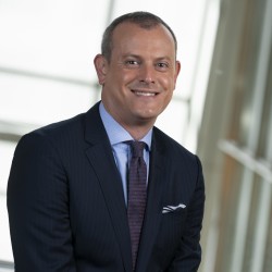 Marc Schloss Headshot in suit and tie