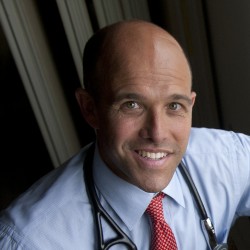 Pieter Cohen with stethoscope and red tie