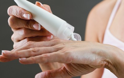 person applying lotion to hands person applying lotion to hands