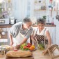 elderly couple of east Asian descent cooking together
