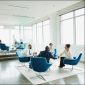 Group of Four Professionals in a Corporate Setting sitting in blue chairs