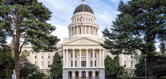 front view of the california state capitol flanked by trees