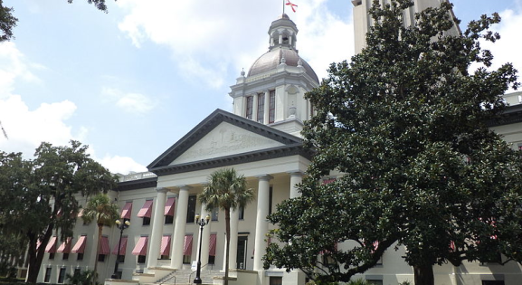 florida capitol building with trees and clouds