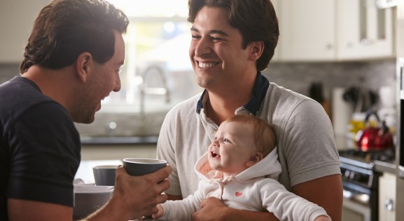 Same Sex Couple with Their Baby in the kitchen