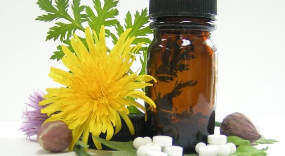 dandelion, capsules, and brown bottle