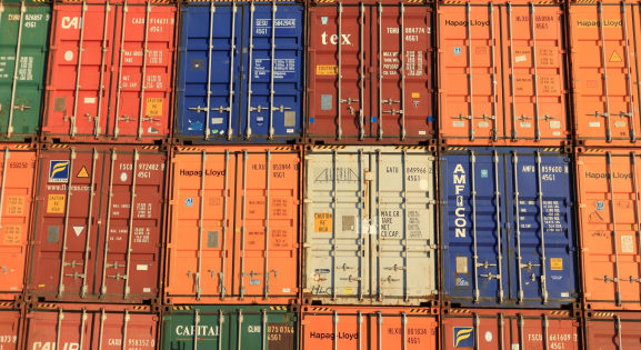 blue and orange stacked shipping containers