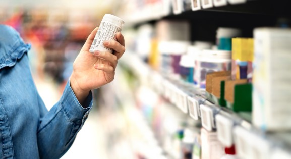 Customer in Store Looking at Label