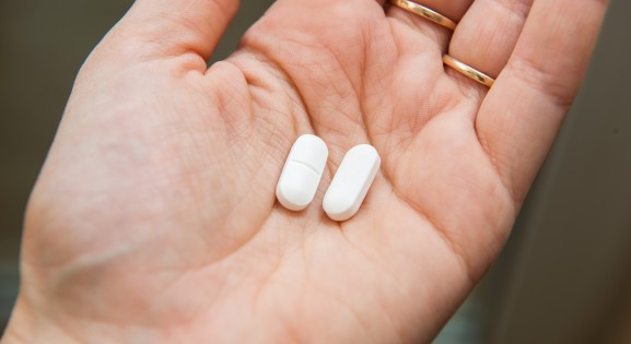 Acetaminophen tablets in hand