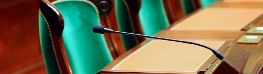Empty Green Chair in Government Building with microphone