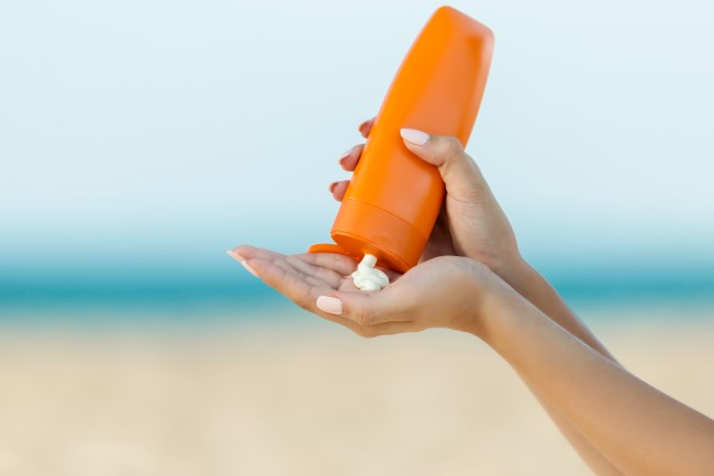 orange bottle of sunscreen