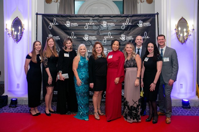 Gala 2024 attendees posing for photo on red carpet